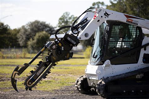 digging a trench with skid steer|used skid steer trencher attachment.